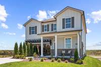 This is a photo of one of our model homes. Please know that some of the exterior and interior finishes, paint, and features may vary.