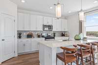 This is a photo of one of our model homes. Please know that some of the exterior and interior finishes, paint, and features may vary.