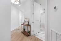 View of hallway and full bath.  This condo has been redone and is just like new
