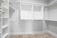 Large walk in closet with built in shelves