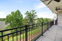 Private balcony that can be accessed from the living area and the primary bedroom