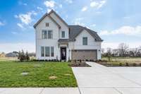 NOTE***ALL pics are of a MODEL HOME with different upgrades and features. This home listed is under construction and will have Brick front and added garage workshop feature.