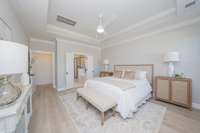 Relaxing primary suite with plank flooring