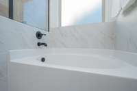 Soaking tub for relaxing in this spacious bath