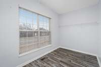 Another view of primary suite walk in closet