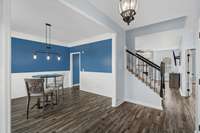 Upon entering the home, you will experience a nice foyer with formal dining or office to the left and the open living room to kitchen straight ahead past the stairs.  Primary suite is to the right of the stairs.