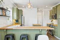 The kitchen is full of character with adorable green cabinets paired with light wood countertops. 2819 Silver Springs Ct   Murfreesboro, TN 37128