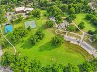 Aerial view of Sevier Park highlights its tennis courts, playground, and walking paths—just steps from your new front door.