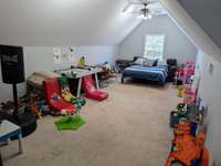 Bonus Room -  A Well LOVED ROOM!  Lots of Fun times here!  Located over the garage and just a few steps away from a generous Full Bath makes for a Flexible/Multi-Purpose Room! Just imagine the possibilities!