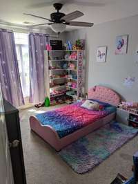 Bedroom #3 - Well equipped for this highly adored little princess yet a neutral pallet - Gray walls and cream carpet ensures this space can convert to any decor.