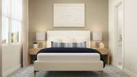 Second bedroom features private en suite bath. These are artist's renderings of staged rooms, not actual home listed.