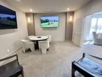 Transform movie nights and game days into an immersive entertainment experience with a luxury media room designed for comfort and style.