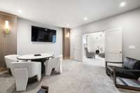 Adjacent to the bonus room, the dedicated media room creates the ultimate cinematic experience for movie nights, sports viewing, or gaming marathons.