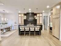 Whether preparing an intimate dinner or hosting a grand celebration, this chef-inspired space brings both flair and function to modern luxury living.