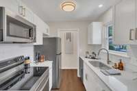 New cabinets with soft close, quartz countertops and new stainless steel appliances