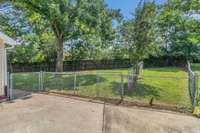 Fenced backyard with a separate dog run.