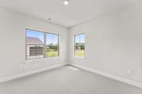 Secondary bedroom *photo is a different homesite with a similar floor plan and elevation*
