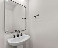 First floor powder room *photo is a different homesite with a similar floor plan and elevation*