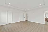Spacious and bright primary bedroom *photo is a different homesite with a similar floor plan and elevation*