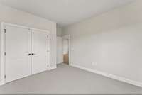 Secondary bedroom *photo is a different homesite with a similar floor plan and elevation*