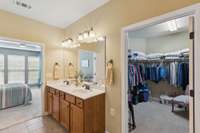Double sinks, tiled floors, and massive walk in closet.