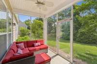Screen Room with ceiling fan and decorative floor.