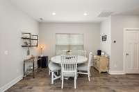 The dining space is ideally situated adjacent the kitchen creating a warm and functional hear of the home.