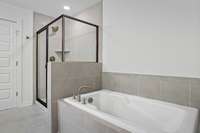 Picture of the optional Tile shower w/tub and tile surround that is included on this home.  Colors and selections may vary