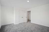 One of the spacious secondary bedrooms.  Colors and selections may vary