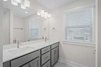 Bath #2 includes double vanity with QUARTZ countertops. Actual Home