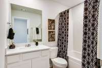 Secondary Full bath with Quartz counter tops.