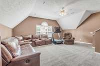 Up the kitchen stairs you will find a large bonus space, great for a media room or playroom.