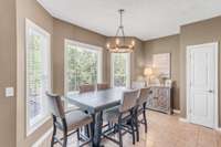 An informal dining area/ breakfast nook overlooks the backyard.