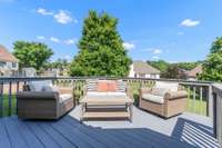 Relax on this freshly painted deck off of the living room, overlooking the manicured backyard.