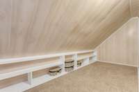 So many uses for this space! Child's play space, reading nook, or additional storage...