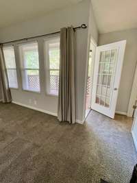 Tons of natural daylight flows through the windows in the Living Room. Newly installed SunSmart Total Blackout Curtains can stay with condo.