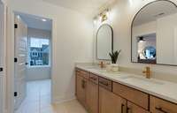 ***Picture Taken From Valleybrook Model Home In Millstone. Upgraded options in home***  Bath #2 includes tile flooring and double sinks with quartz countertops.