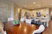 ***Photo is taken from a previous Eastfield model home in another community***  Right next to the Kitchen is the Cafe, designed to comfortably fit a 6-person table. We have added additional cabinetry in this space to provide storage for you.