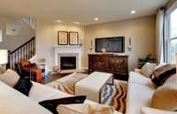***Photo is taken from a previous Eastfield model home in another community***  Our home will include a gas fireplace that is center on the wall as opposed to in the corner like this previous home shows.