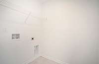 The Laundry Room includes tile flooring and is located on the 2nd floor as well.