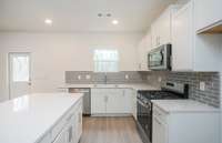 The Kitchen Island offers additional prep space when hosting family and friends for dinner. Additional storage space is also a huge plus with the spacious island.