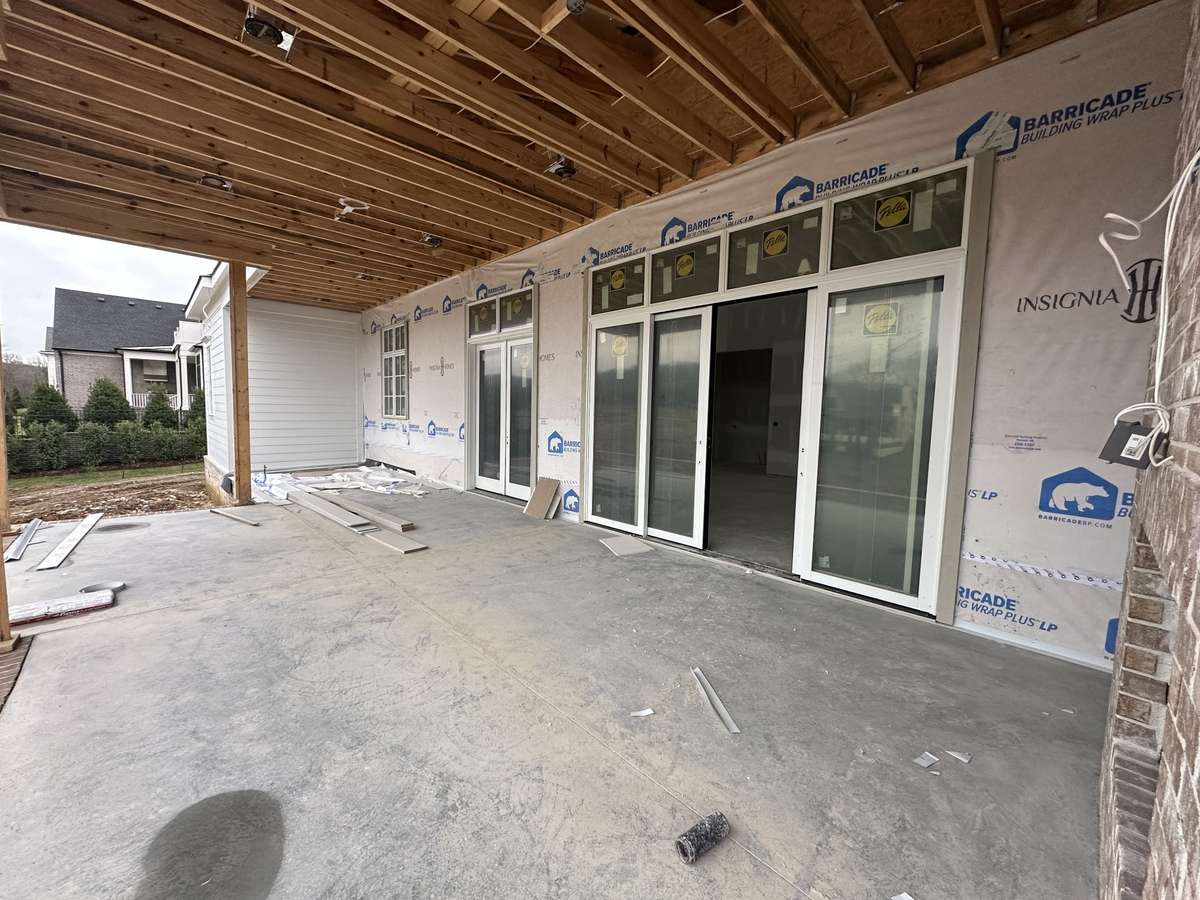 Covered rear porch with fireplace is perfect for all seasons.

*This home is under construction. Photo updated 1/9/26.