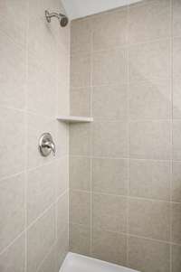 Picture of model home.  Colors and selections may vary.  Picture showing the optional Tile shower and tub that can be built on this home.
