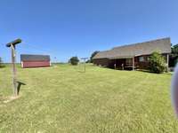View of back of home.  Complete with clothesline!