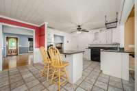 Large, open kitchen with granite countertops and island