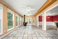 Another view of the Florida sunroom with floor-to-ceiling windows (lifetime warranty through Window World)