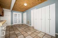 Washer/dryer area with huge pantry, sink, and extra storage