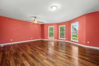 Large primary bedroom on the main floor with bay windows