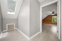 Upstairs landing sitting area with lovely skylight
