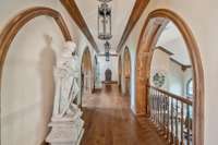 Upstairs the arched hallway guides you to two spacious bedrooms each with its own private en-suite bathroom. Its a moment of elegance that connects the private quarters to the rest of the home